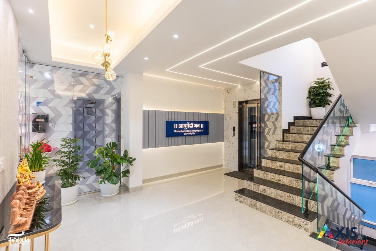 Green marble arched entrance hallway with wooden staircase